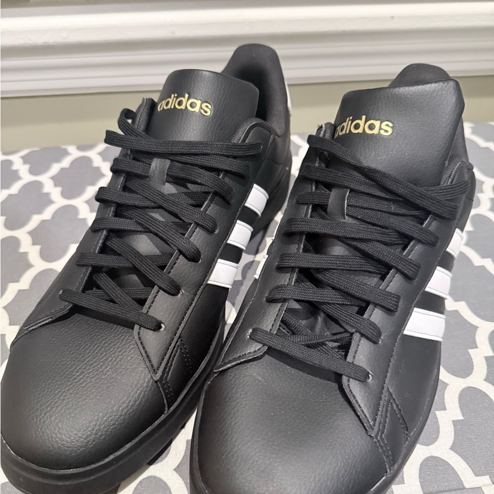 Adidas Sneakers with White Stripes and Gold Logo